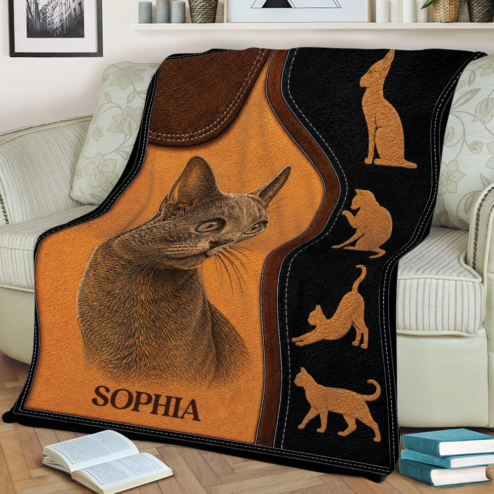 Russian Blue cat throw blanket displayed on a sofa with warm brown and black artwork