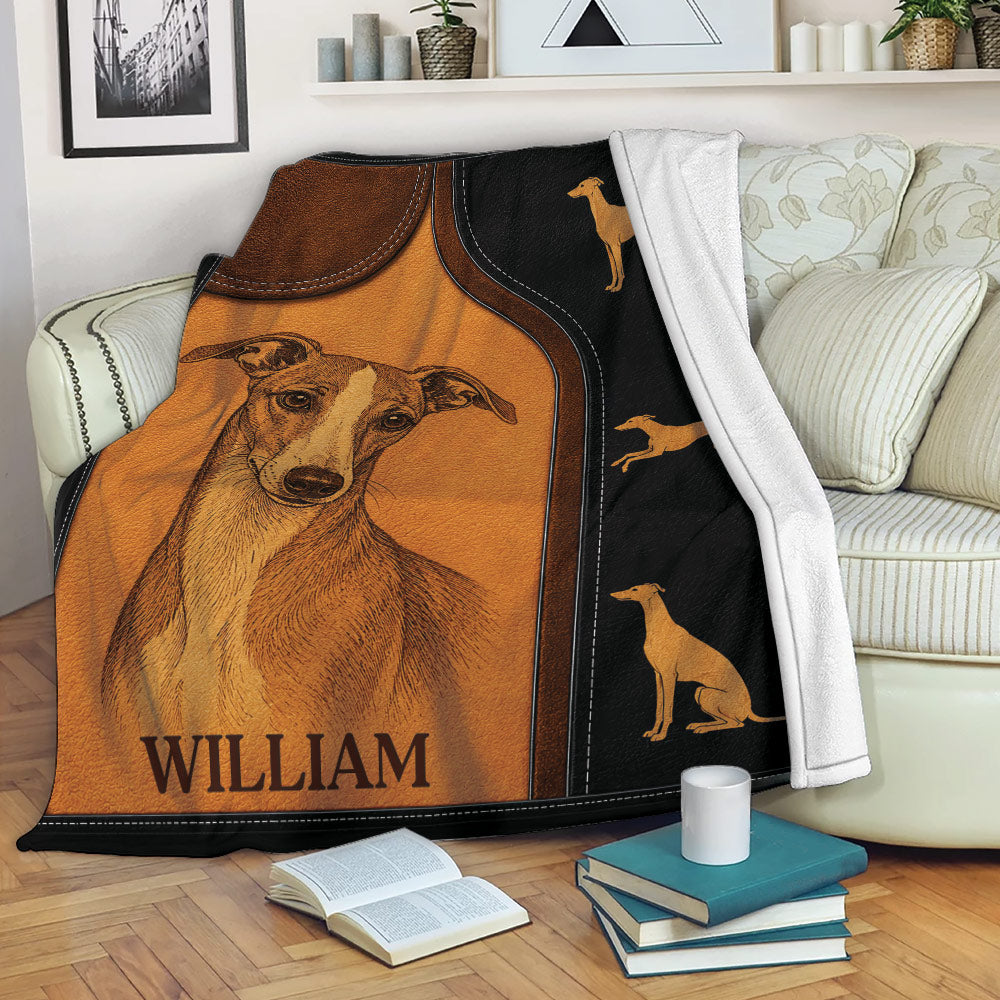Whippet throw blanket displayed on a sofa with vintage leather-look artwork and coordinating dog silhouettes