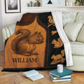 Squirrel throw blanket draped over a sofa with detailed woodland artwork and cozy living room styling