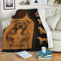 Pitbull blanket draped over a sofa with engraved dog artwork and black and brown leather-look styling