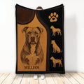 Pitbull throw blanket featuring engraved dog artwork, paw print, and warm brown leather-look design