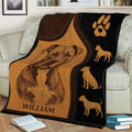 Pitbull throw blanket displayed on a couch with detailed dog illustrations and paw print artwork
