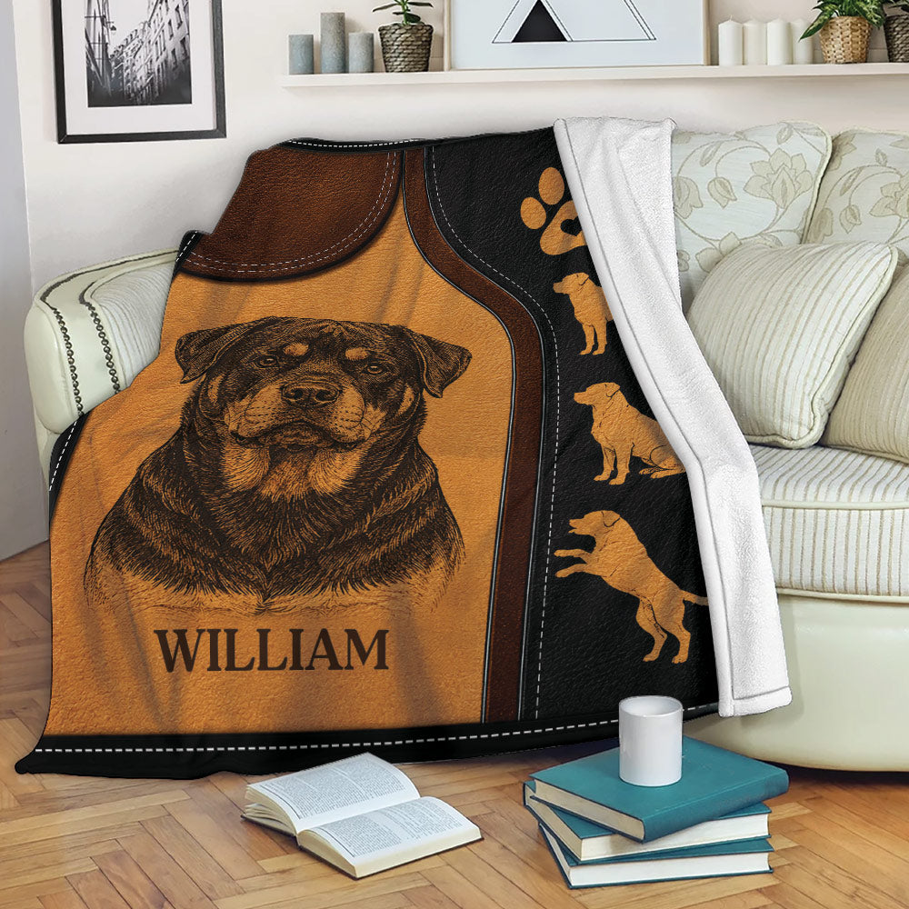 Rottweiler blanket draped over a sofa with rustic dog artwork and paw print design