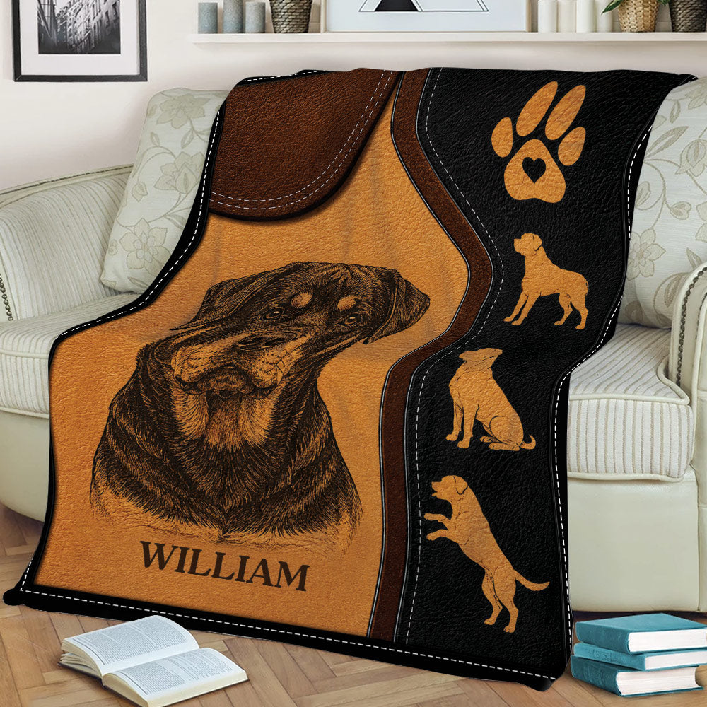 Rottweiler throw blanket displayed on a couch with detailed portrait artwork and dog silhouettes