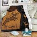 Rustic deer throw blanket draped over a sofa with buck artwork in warm brown and black tones