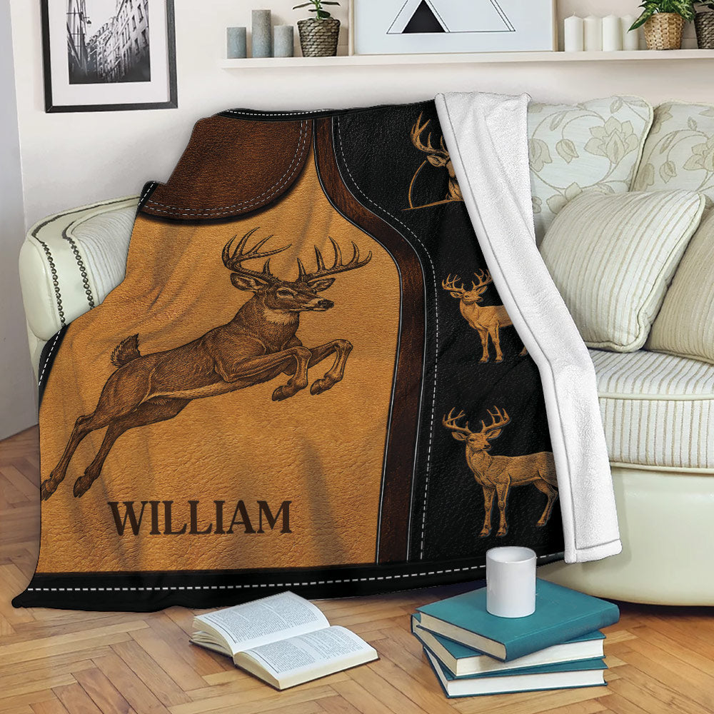 Rustic deer throw blanket draped over a sofa with buck artwork in warm brown and black tones