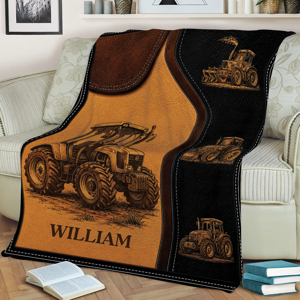 Tractor throw blanket styled on a sofa, featuring detailed vintage farm machinery illustrations