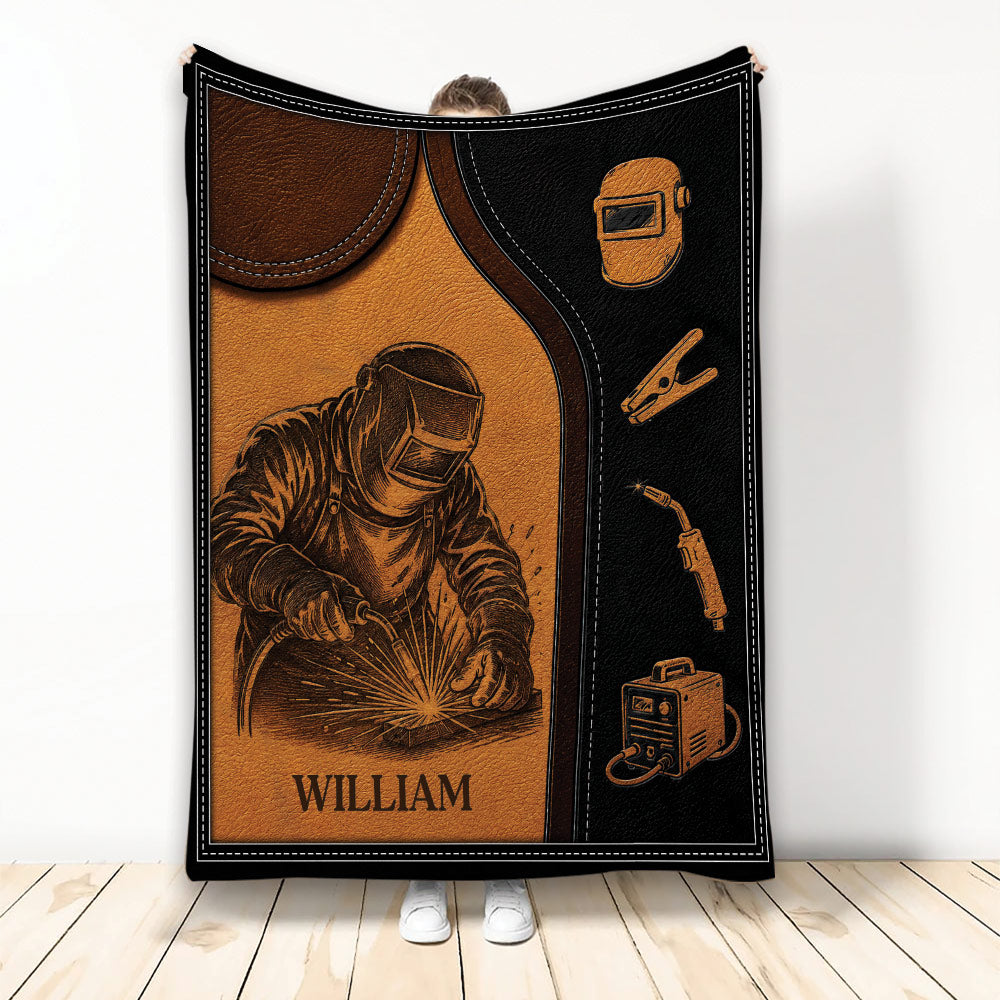 Welder throw blanket featuring a protective welding helmet, sparks, welding tools, and rugged brown artwork