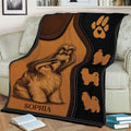Shih Tzu blanket draped over a sofa, featuring long-haired dog artwork, paw print details, and a cozy living room setting