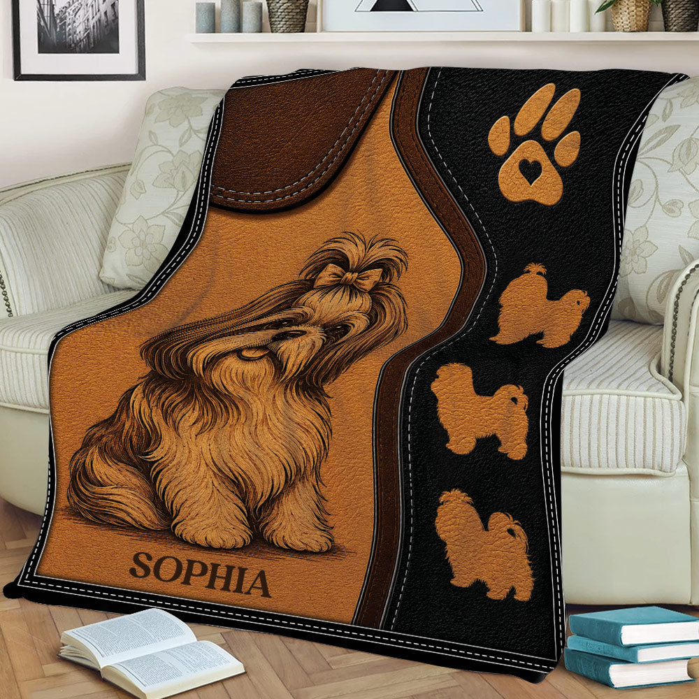 Shih Tzu blanket draped over a sofa, featuring long-haired dog artwork, paw print details, and a cozy living room setting