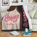 Pink ribbon Breast Cancer blanket displayed on a sofa with butterfly and awareness artwork