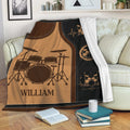 Drum throw blanket displayed across a sofa with vintage music artwork