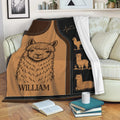 Alpaca throw blanket draped over a sofa, featuring cozy brown alpaca artwork and decorative illustrations