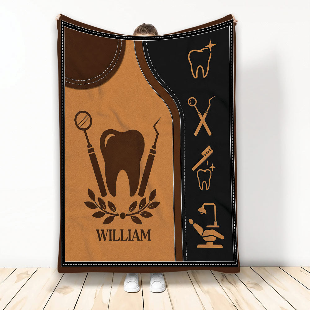 Dentist throw blanket with tooth silhouette, dental instruments, and warm brown and black artwork