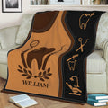 Dental-themed throw blanket draped over a couch with tooth and dentist instrument illustrations
