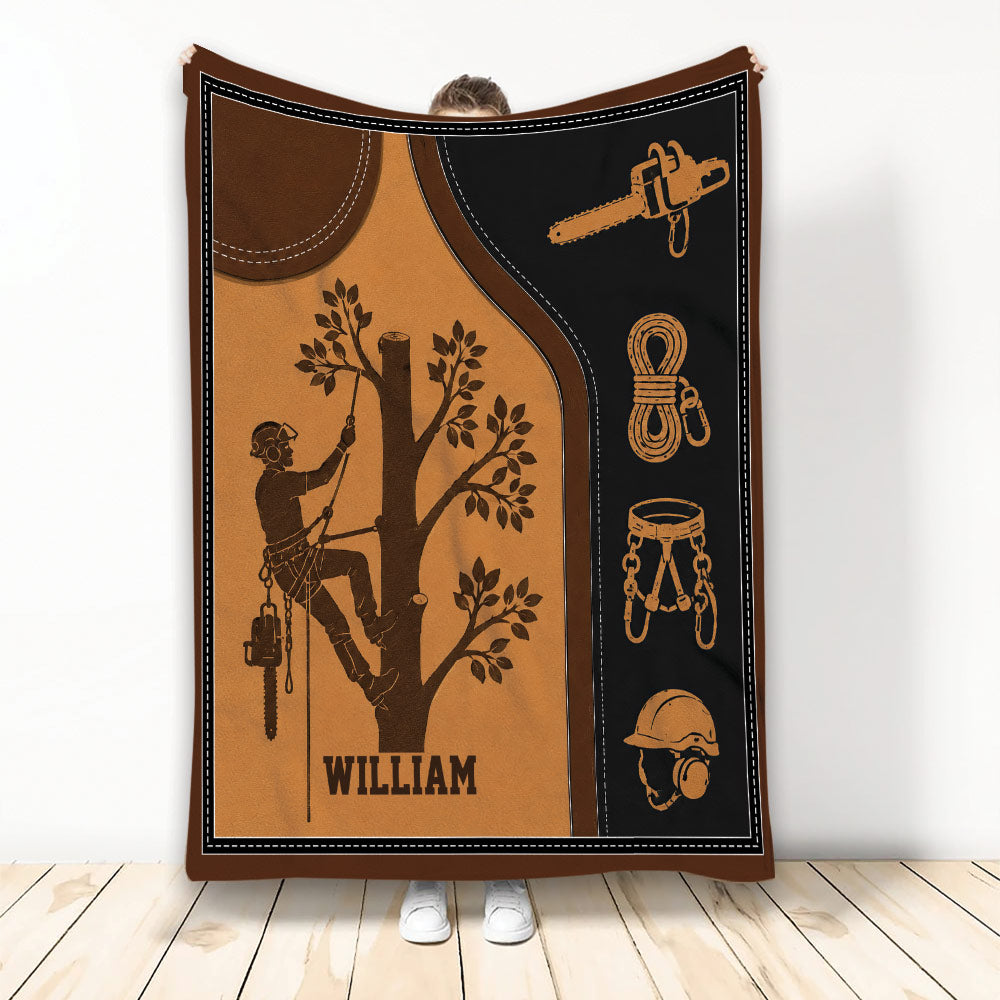 Arborist throw blanket featuring a tree climber with chainsaw, rope, harness and safety helmet artwork