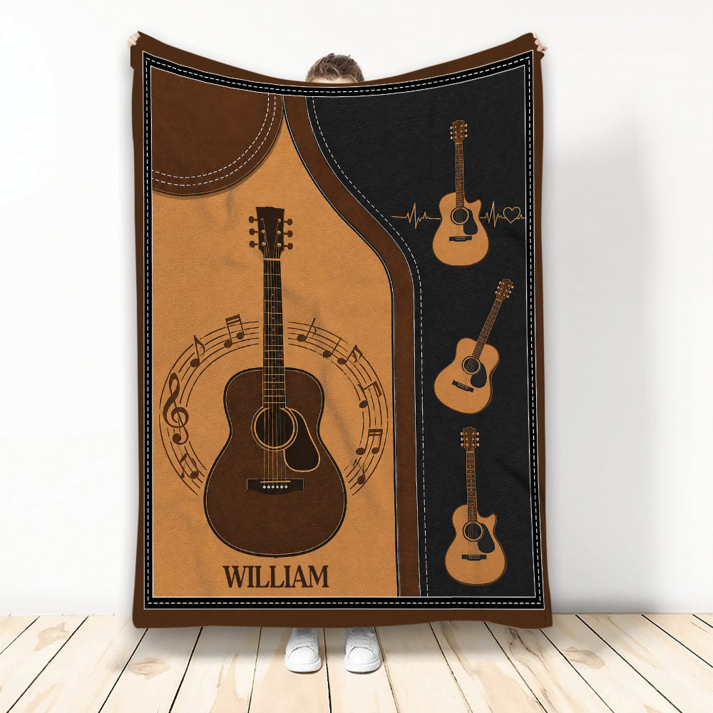 Custom guitar blanket featuring acoustic guitars, musical notes, warm brown tones, and a black border