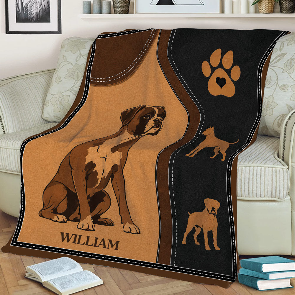 Close view of a Boxer dog throw blanket on a couch with vintage-inspired brown and black artwork