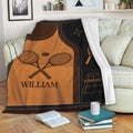 Custom tennis blanket draped over a sofa with racquet, tennis ball, and court illustrations