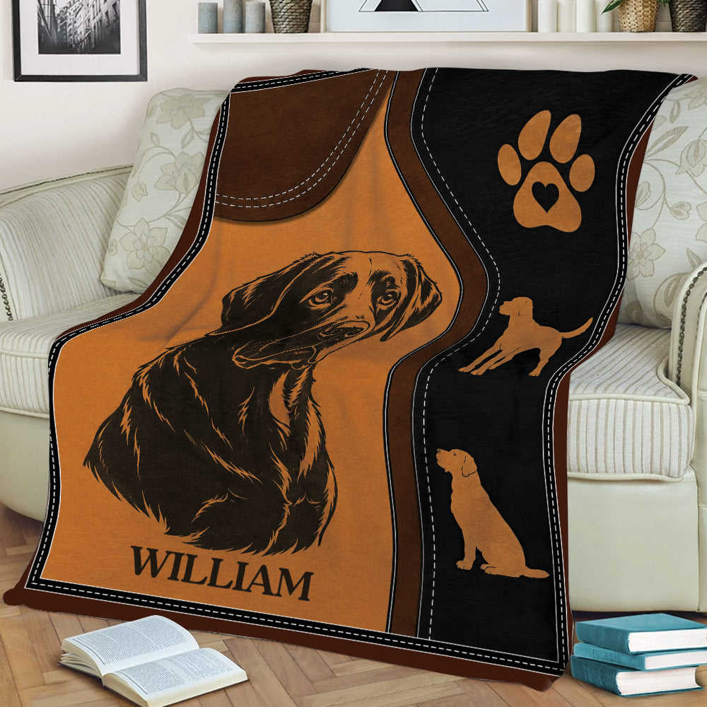 Rustic Labrador Retriever blanket displayed on a couch with a realistic dog illustration and paw emblem