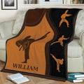 Karate throw blanket displayed on a sofa with multiple martial arts action silhouettes