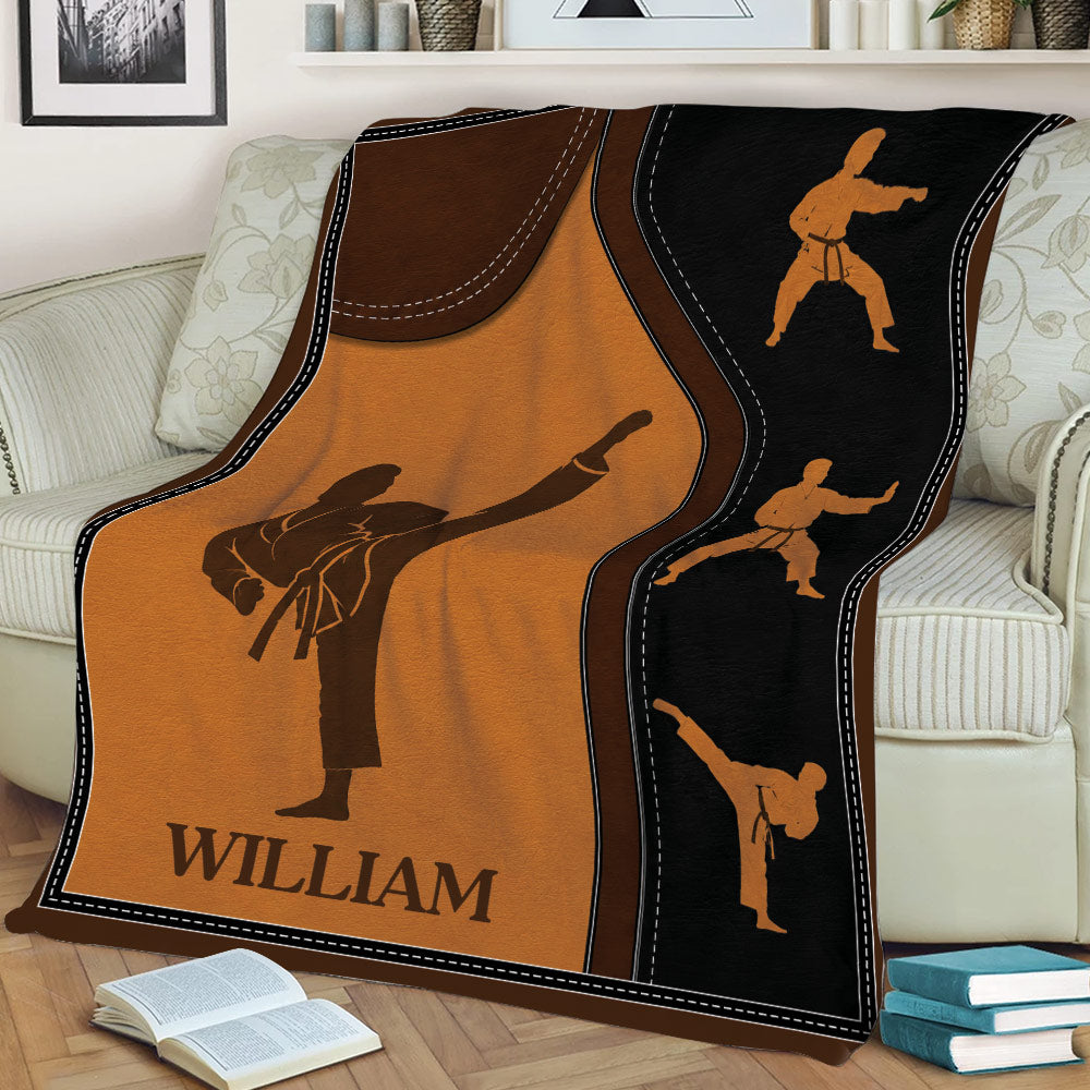 Karate throw blanket displayed on a sofa with multiple martial arts action silhouettes