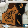 Close view of Belgian Shepherd throw blanket featuring a shepherd portrait, paw print, and dog silhouettes