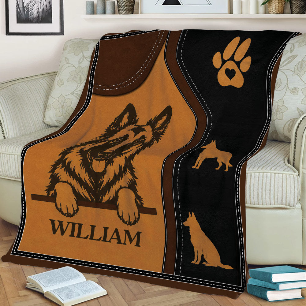 Close view of Belgian Shepherd throw blanket featuring a shepherd portrait, paw print, and dog silhouettes