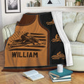 Snowmobile rider throw blanket displayed on a sofa with bold brown, black, and patriotic-inspired artwork