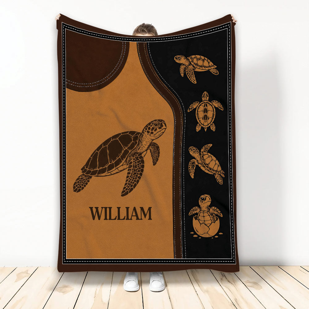 Turtle throw blanket with sea turtle illustrations in warm brown, black, and copper tones