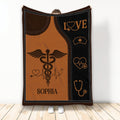 Nurse throw blanket with caduceus, stethoscope, heart monitor, and nursing symbols
