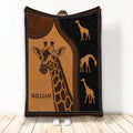 Giraffe throw blanket with rustic brown and black stitched artwork displayed in a room