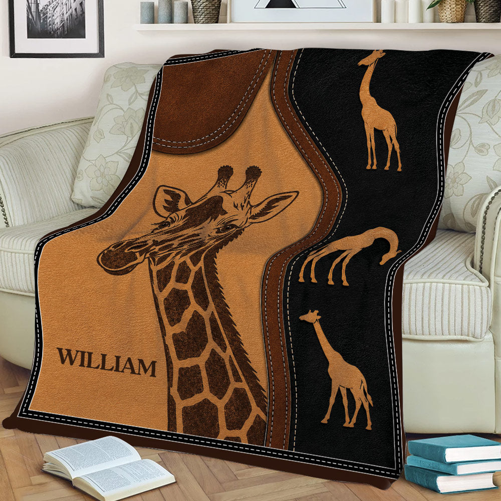 Giraffe throw blanket styled on a couch with vintage leather-look wildlife artwork