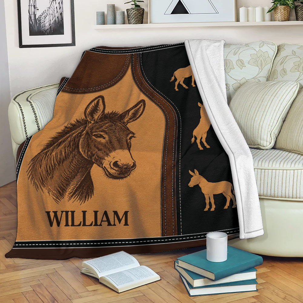 Donkey throw blanket displayed on a sofa with rustic brown and black artwork
