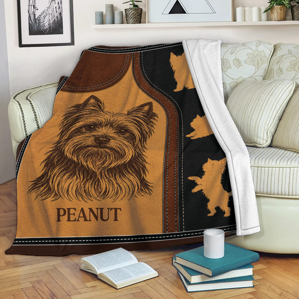 Yorkshire Terrier throw blanket displayed across a sofa with bold brown, black, and leather-look dog artwork
