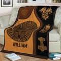 Viking blanket displayed on a couch with Nordic warrior artwork, dragon symbols, longship, and hammer