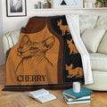 Sphynx cat throw blanket displayed on a sofa with amber and black hairless cat artwork