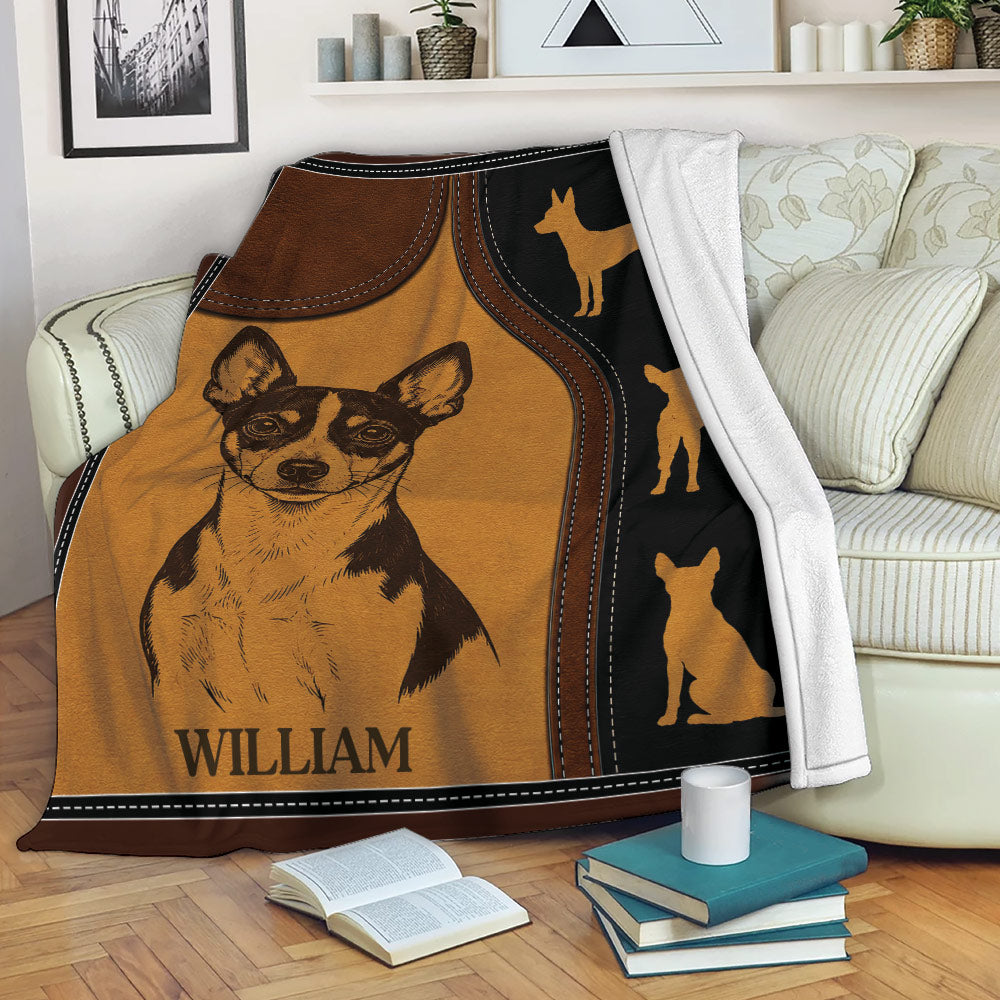 Rat Terrier blanket displayed on a sofa with warm brown artwork, black accents, and a detailed dog illustration