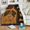 Cavalier King Charles throw blanket draped over a sofa with warm vintage dog artwork