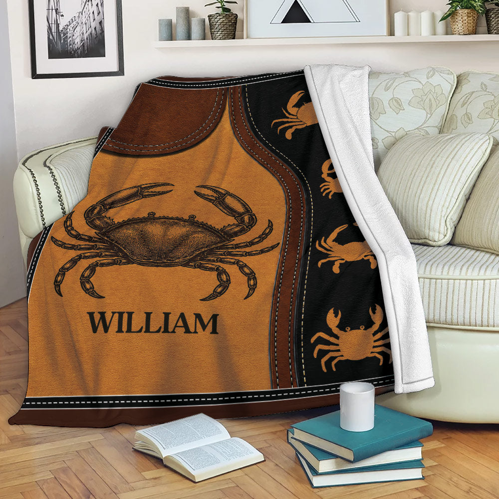 Vintage crab throw blanket draped over a living room sofa with books nearby