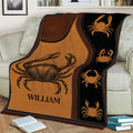 Rustic crab blanket spread across a sofa with repeated crab artwork