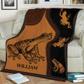 Frog throw blanket styled across a sofa, featuring a large illustrated frog and smaller frog silhouettes