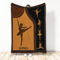 Ballet throw blanket displayed upright with dancer silhouettes in warm brown, gold, and black artwork