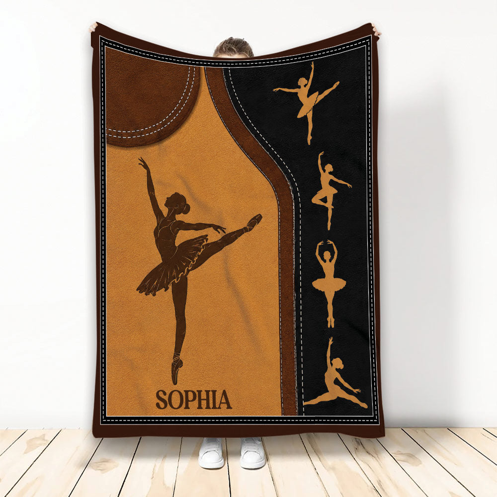 Ballet throw blanket displayed upright with dancer silhouettes in warm brown, gold, and black artwork