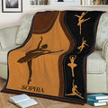 Ballet dancer throw blanket styled across a sofa, featuring silhouette artwork and a decorative stitched border