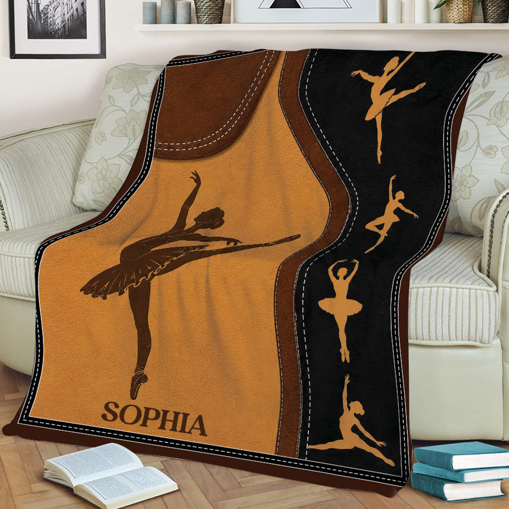 Ballet dancer throw blanket styled across a sofa, featuring silhouette artwork and a decorative stitched border