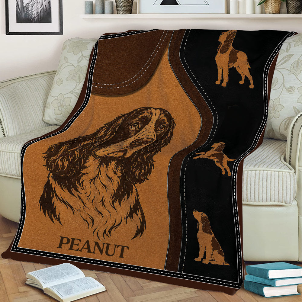 English Springer Spaniel throw blanket displayed on a sofa with portrait and running dog illustrations