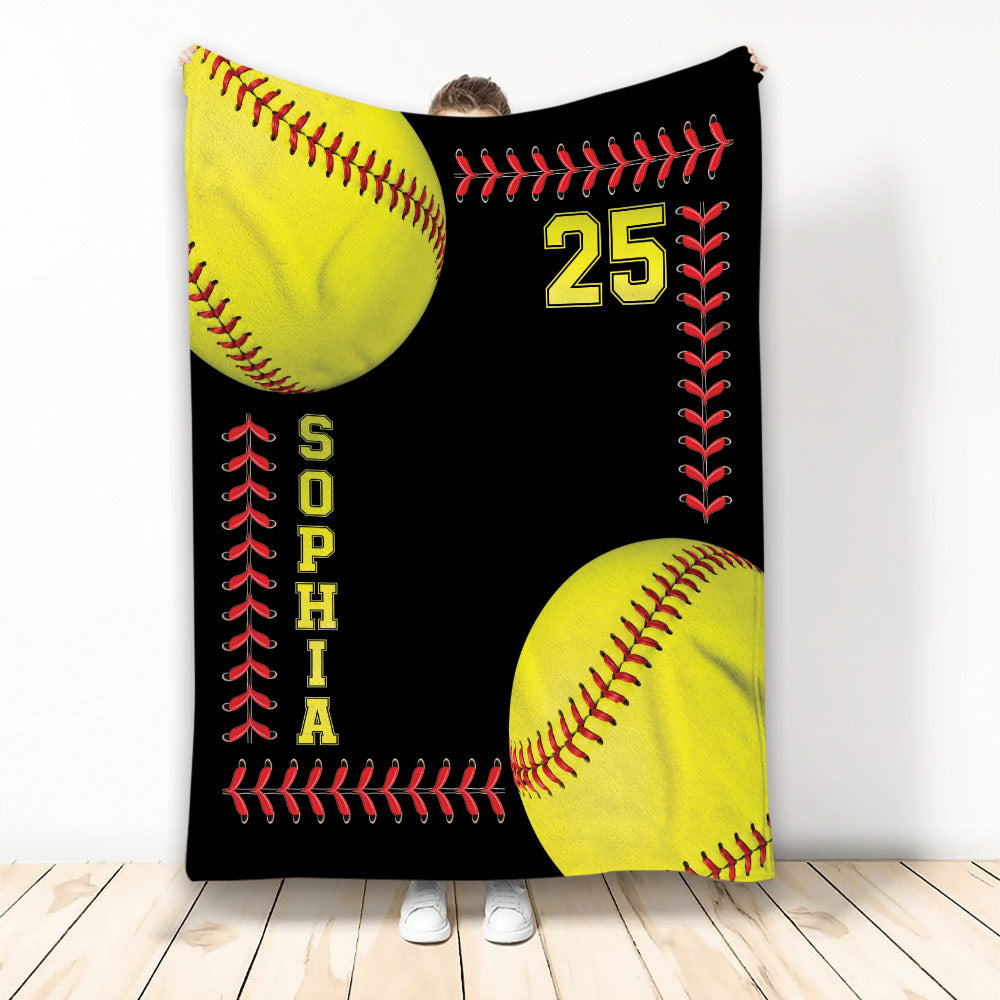 Softball throw blanket with yellow softballs, red stitching, black background, and bold sports artwork