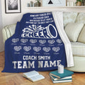 Navy cheerleading blanket draped over a sofa with megaphone artwork and coordinated team design