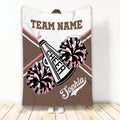 Brown and pink cheerleading blanket featuring pom poms, megaphone artwork, and team graphics